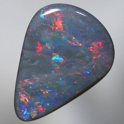 SOLID SEMI BLACK OPAL Sparkles of fire red and orange over blue green